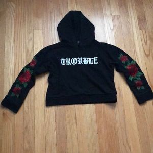 A cropped black Sweater